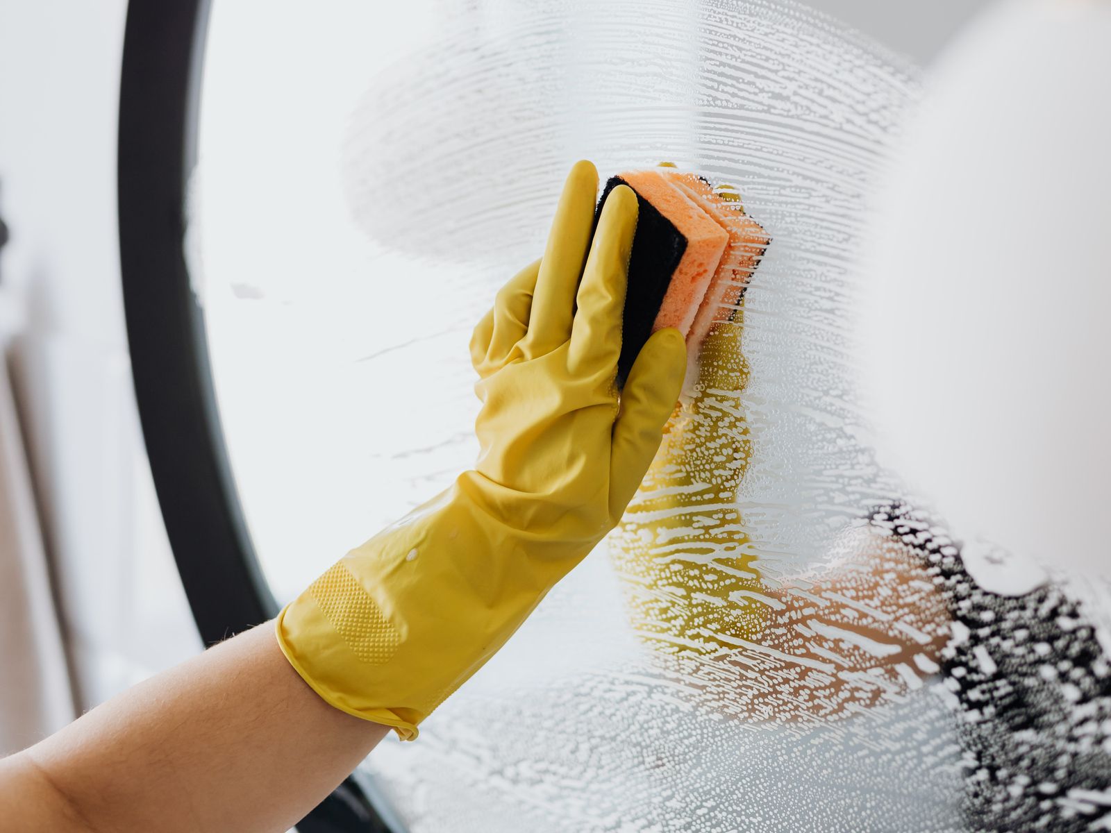 Detail cleaning a mirror in a Knoxville home